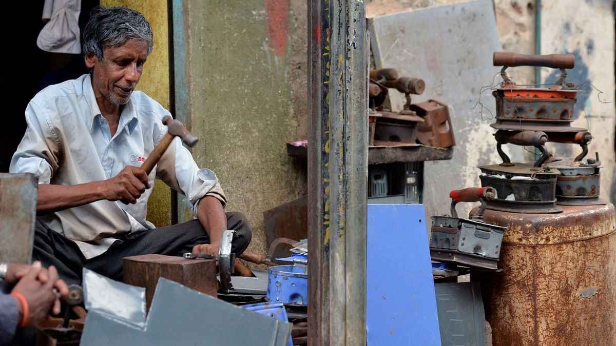 A skilled labourer makes a traditional charcoal iron at his shop in Shivajinagar in Bangalore.