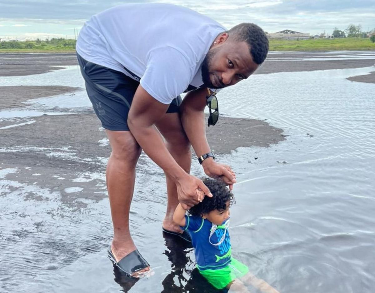 A candid pic of Kieron Pollard with his kid. Credit: Instagram/kieron.pollard55