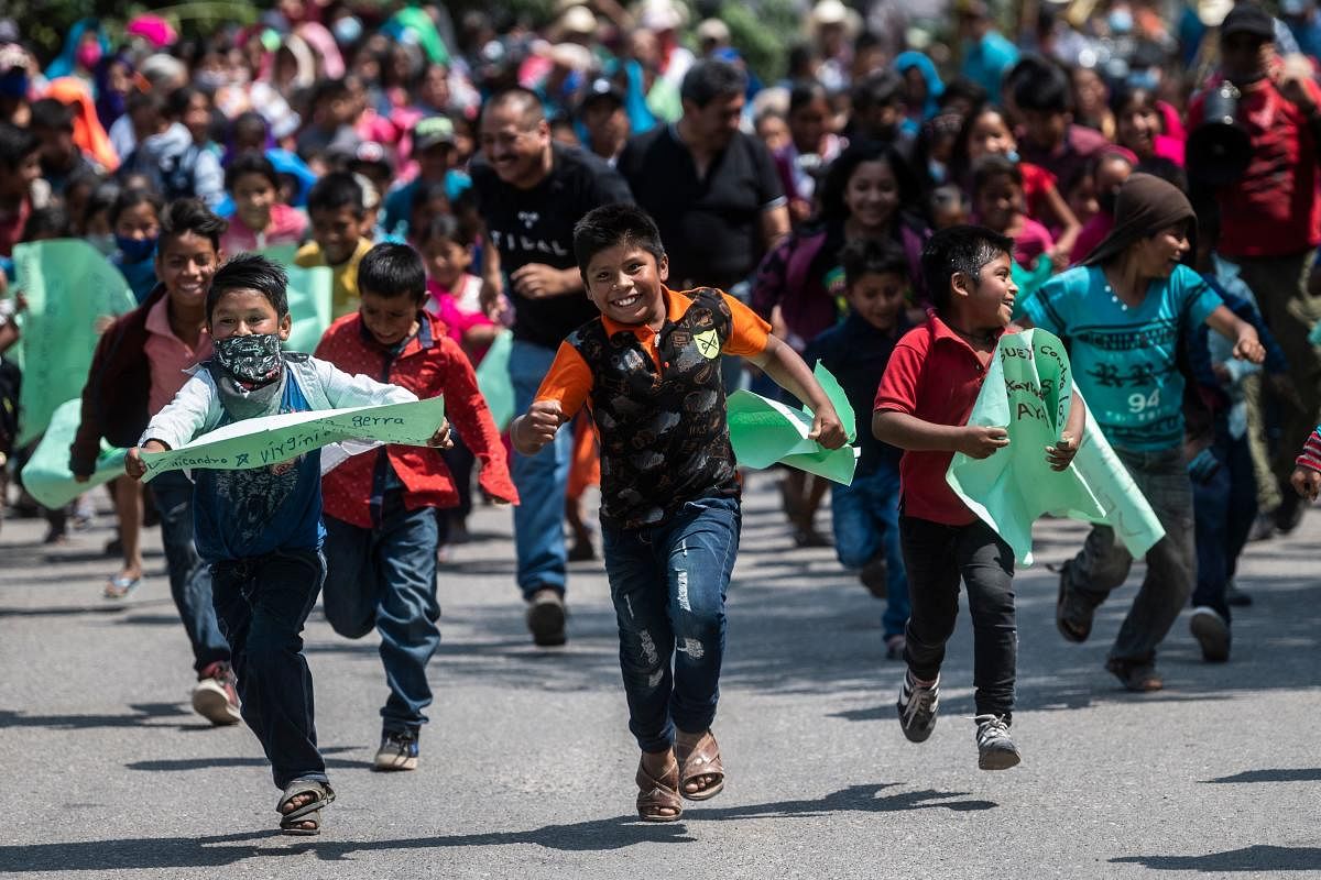 Children take part in a demo for justice and the end of violence in the framework of the celebration of Children's Day in Alcozacan, Guerrero state, Mexico. Credit: AFP Photo