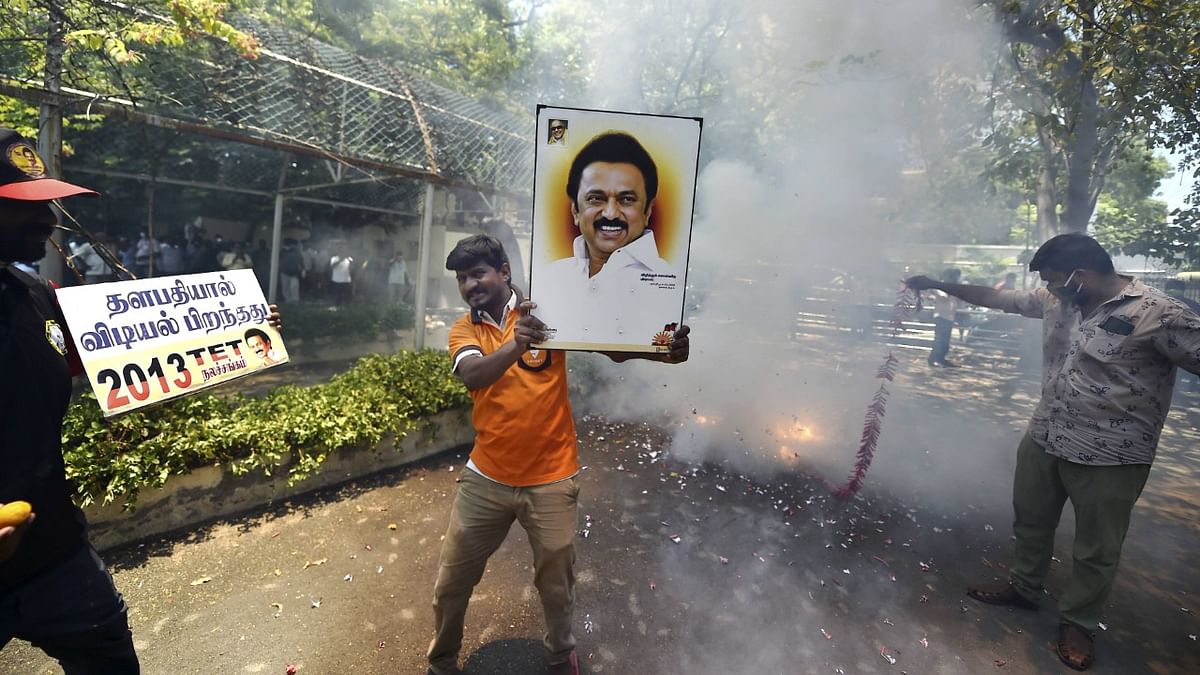 Party workers celebrate as trends show DMK leading in Tamil Nadu.