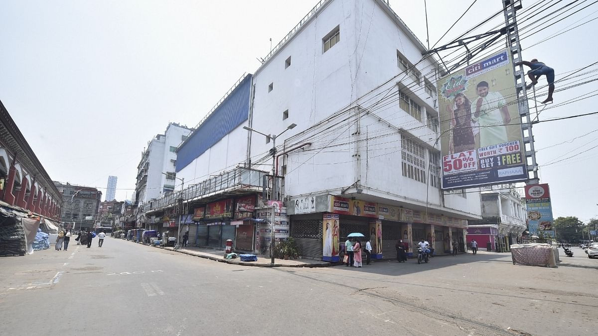 City street wears a deserted looks as state government decides to impose a curfew to combat the Covid-19 epidemic, in Kolkata. Credit: PTI