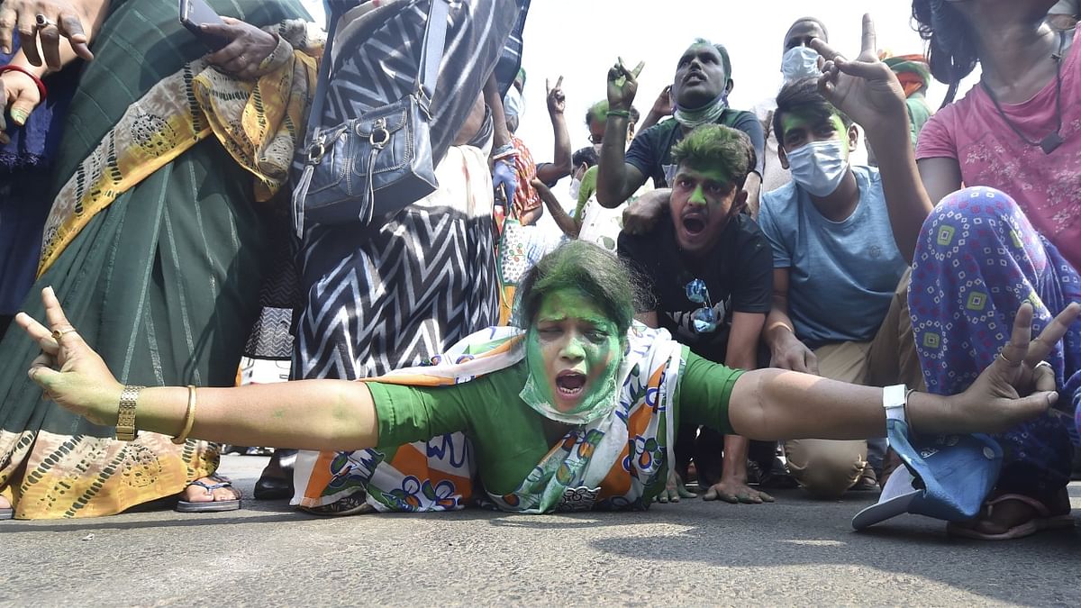 TMC supporter celebrate their party's winning trend in the West Bengal state assembly elections. Credit: PTI