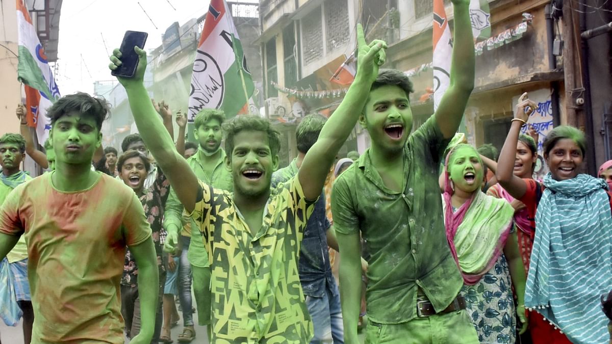 Trinamool Congress supporters celebrate their party's winning trend. Credit: PTI