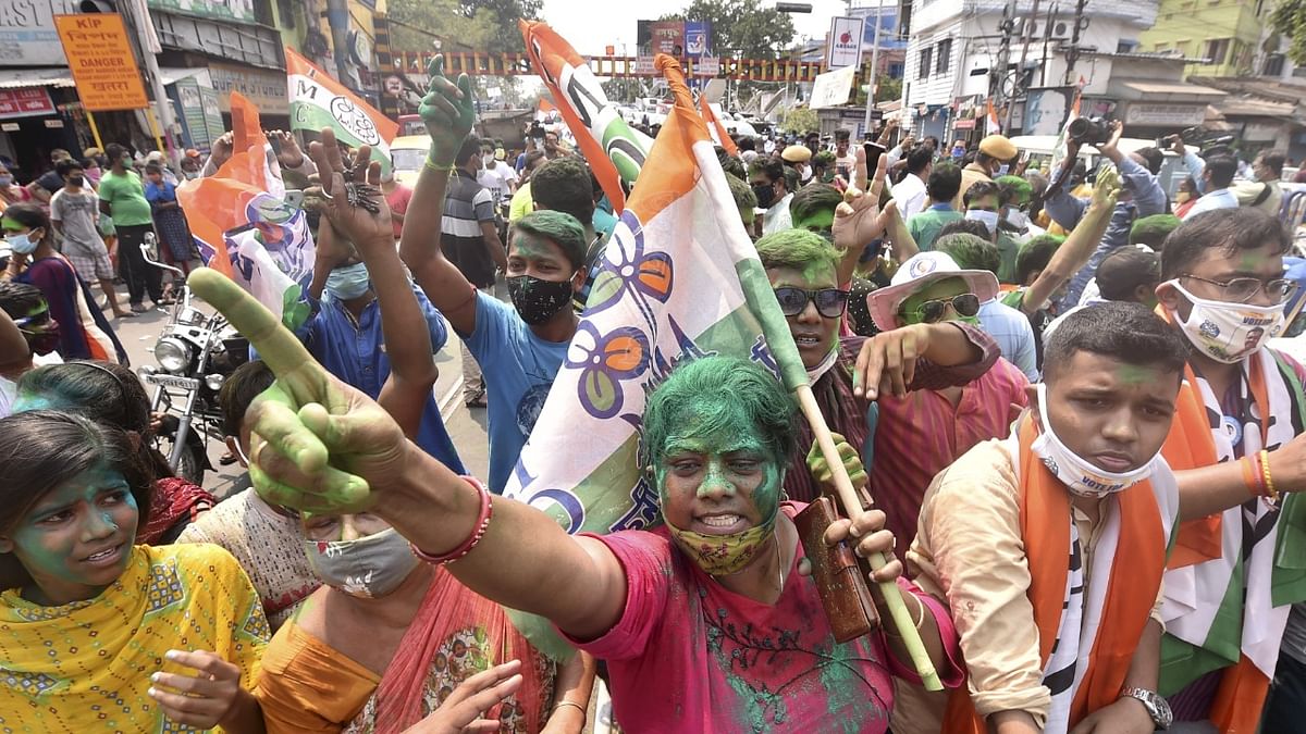 MC activists celebrate the winning trend of the party in the State Assembly polls, in Kolkata. Credit: PTI