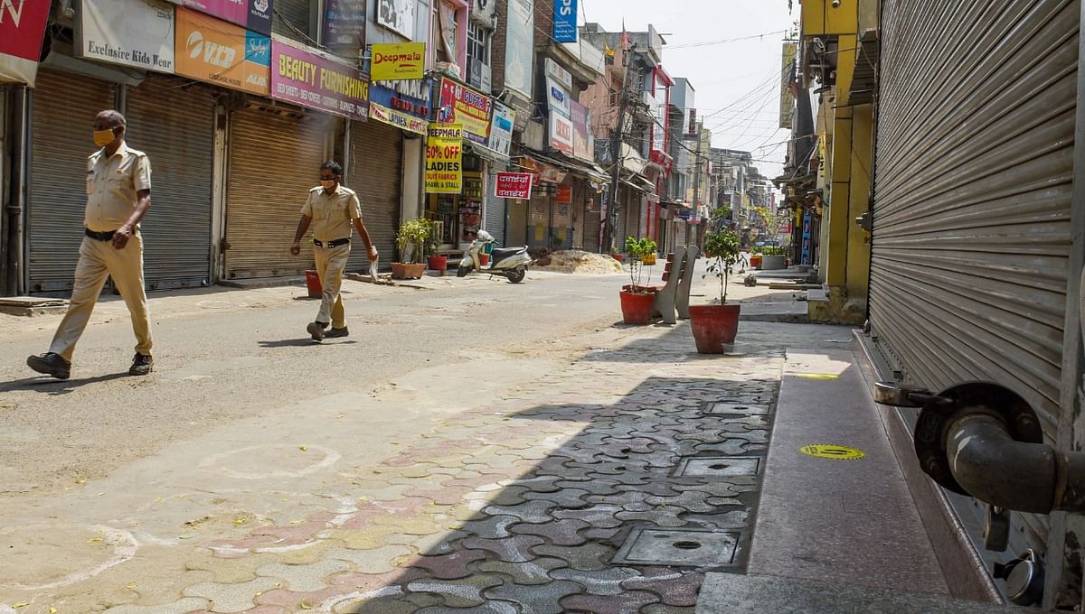 A market area wears a deserted look during weekend lockdown imposed in the wake of rising Covid-19 cases across the country, at Sadar Bazar in Gurugram. Credit: PTI