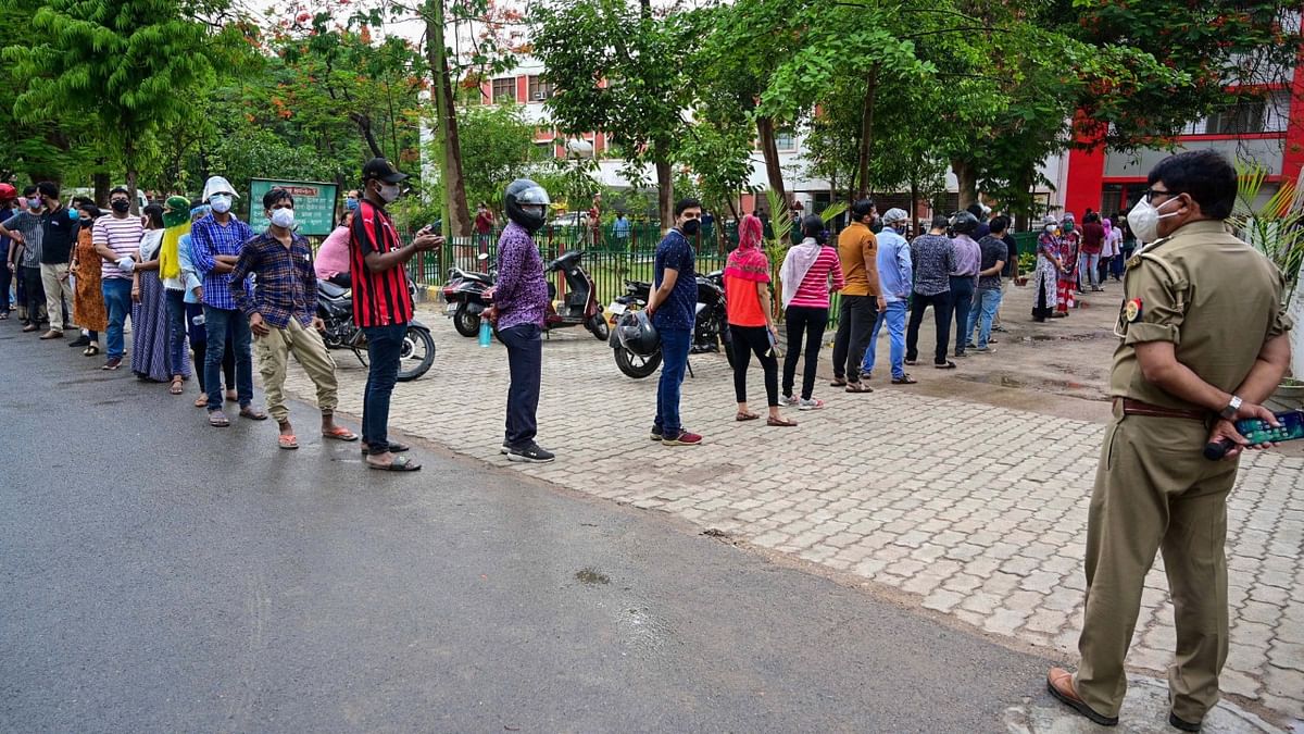 People above 18 queue at a vaccination center for Covid-19, at Moti Lal Nehru Medical College in Prayagraj.