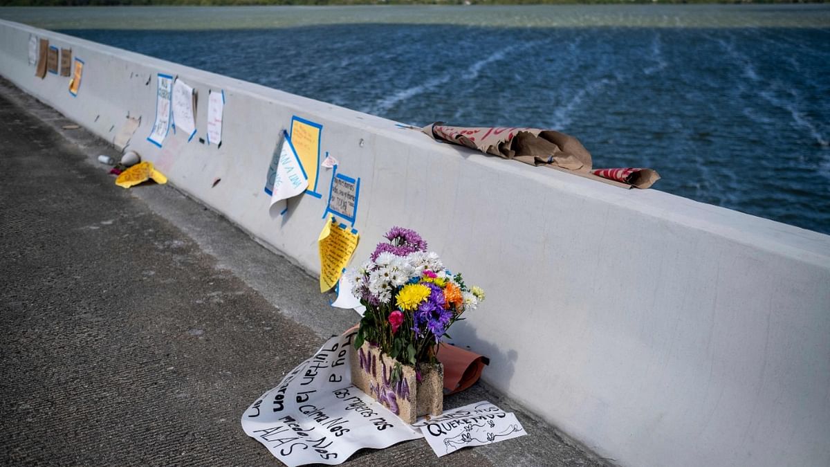 Flowers and messages are left on the Teodoro Moscoso Bridge, where the body of Keishla Rodriguez was allegedly dumped by Puerto Rican Boxer, Felix Verdejo in San Juan, Puerto Rico. Credit: AFP Photo