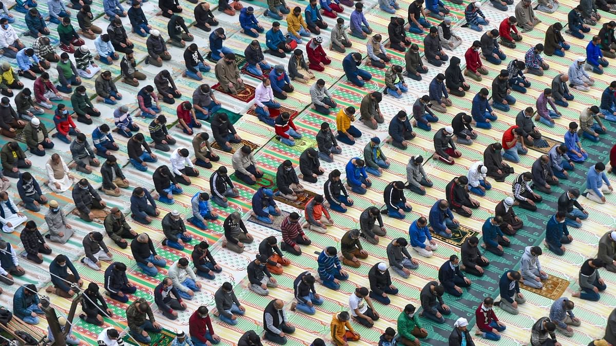 Muslims offer 'Dhuhr' prayers, while maintaining social distancing as precaution against COVID-19, on the first day of Ramadan in Srinagar. Credit: PTI
