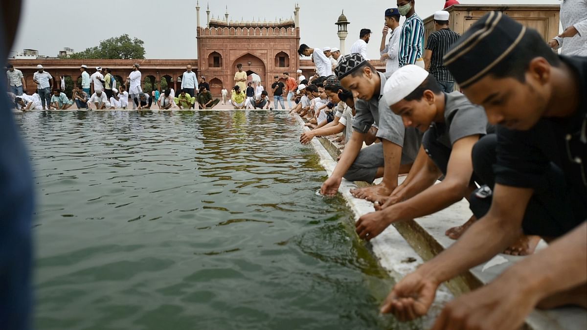 Muslim devotees wash their hands before prayers during the ongoing holy fasting month of 'Ramadan', at Jama Masjid in New Delhi. Credit: PTI