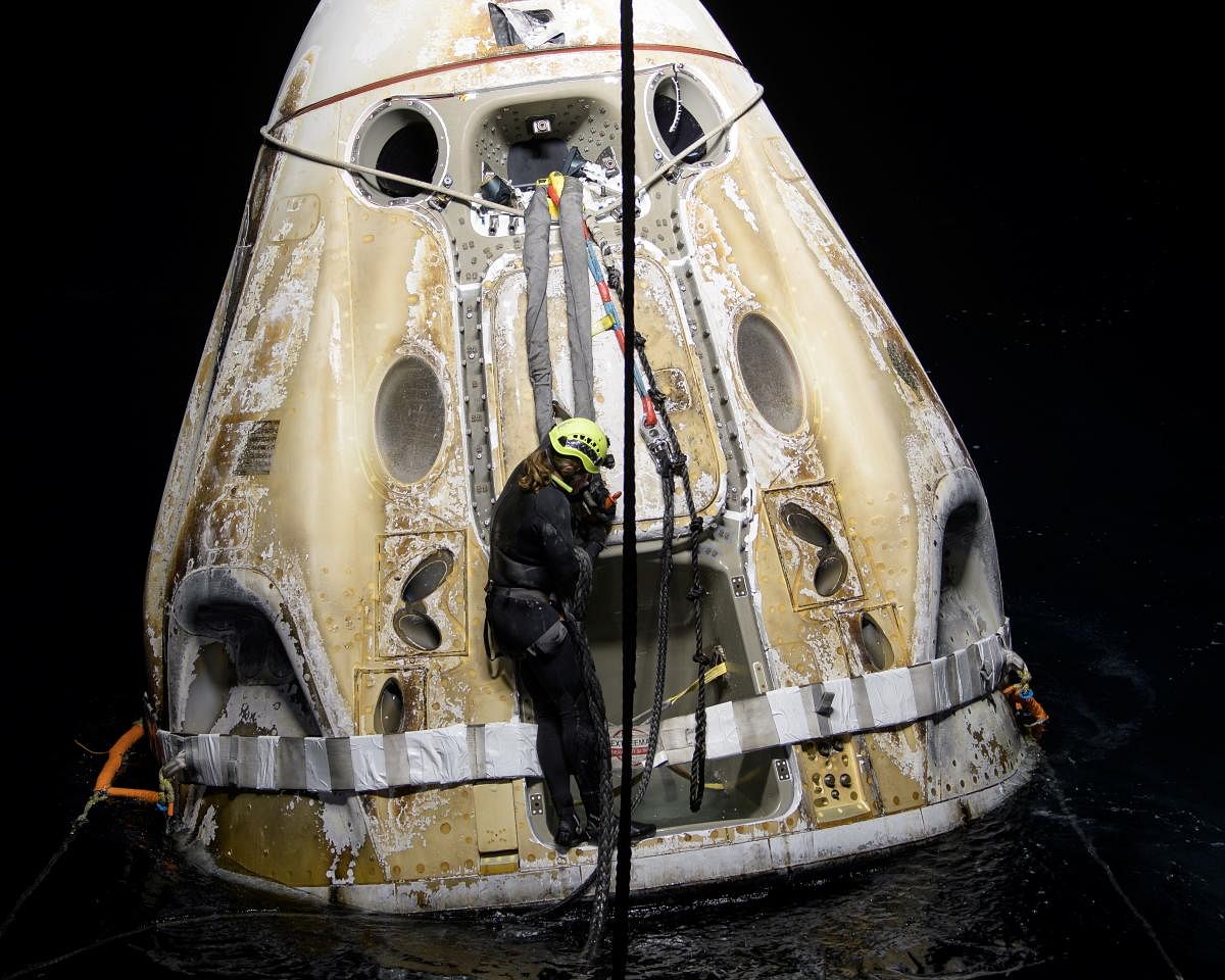 Support teams work around the SpaceX Crew Dragon Resilience spacecraft shortly after it landed with NASA astronauts Mike Hopkins, Shannon Walker, and Victor Glover, and Japan Aerospace Exploration Agency (JAXA) astronaut Soichi Noguchi aboard, in the Gulf of Mexico off the coast of Panama City, Florida, U.S. May 2, 2021. Credit: Reuters Photo