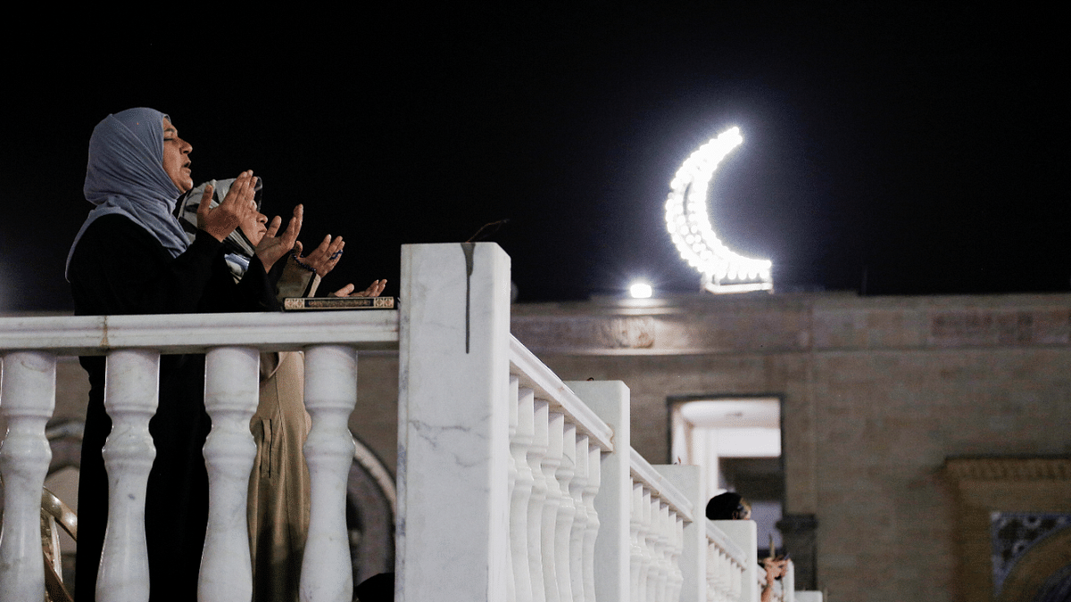 Muslim women pray in the shrine of Sheikh Abdul Qadir Jeelani during the holy month of Ramadan in Baghdad. Credit: Reuters Photo