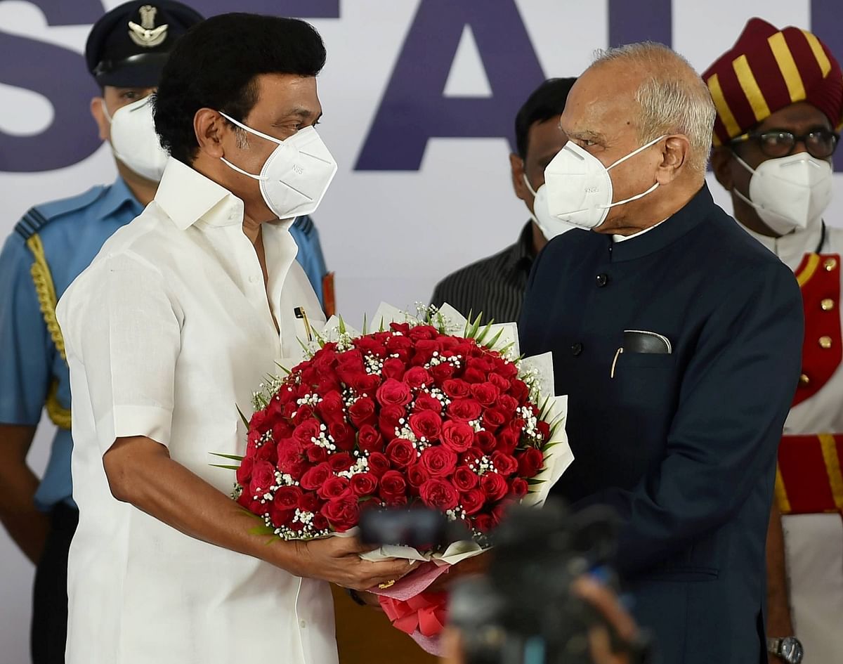 Newly sworn-in Tamil Nadu CM MK Stalin exchanges greetings with Governor Banwari Lal Purohit.