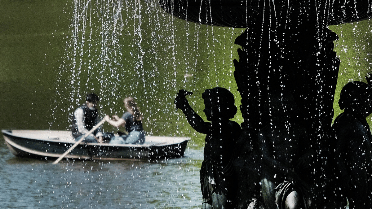 A couple enjoy a rowboat on a warm afternoon in Central Park as New York City begins to re-opens following pandemic lockdowns. Credit: AFP Photo