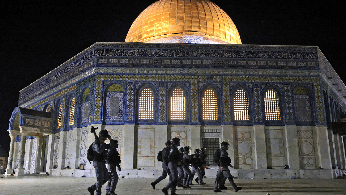 Israeli security forces deploy next to the Dome of the Rock mosque amid clashes with Palestinian protesters at the al-Aqsa mosque compound in Jerusalem. Credit: AFP Photo