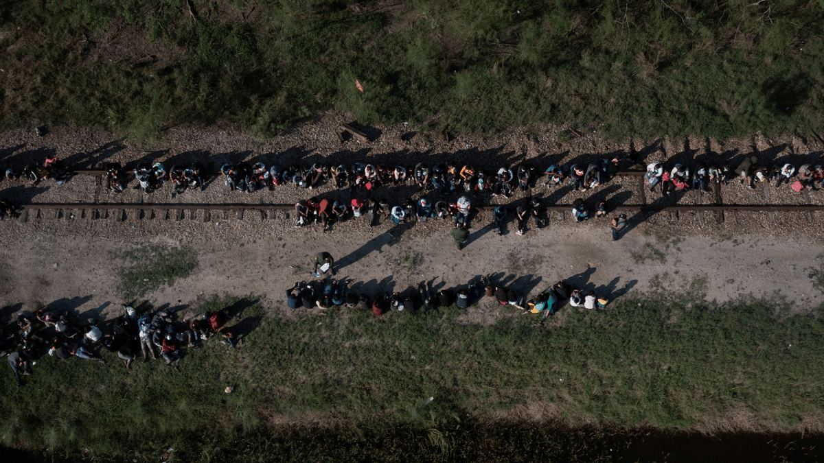 Asylum seeking migrants from Central America are separated into groups, including unaccompanied minors, after dozens crossed the Rio Grande river into the United States from Mexico. Credit: Reuters Photo