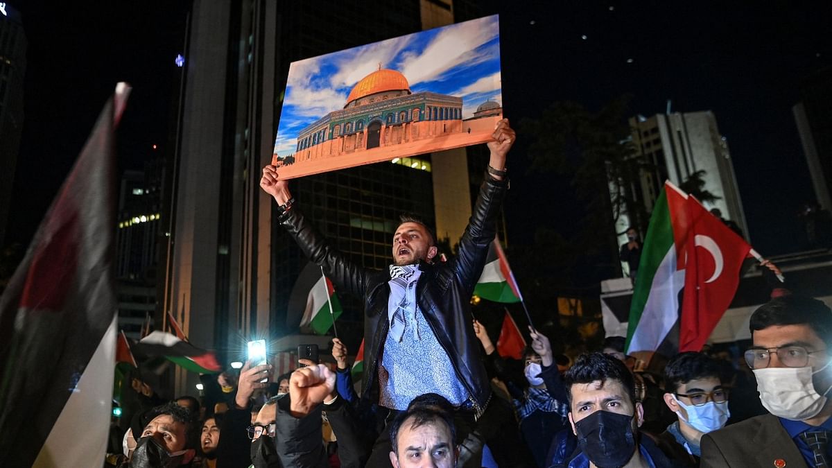 A protester holds a poster of Al-Aqsa mosque during a demonstration against Israel in front of the Israeli Consulate in Istanbul. Credit: AFP Photo