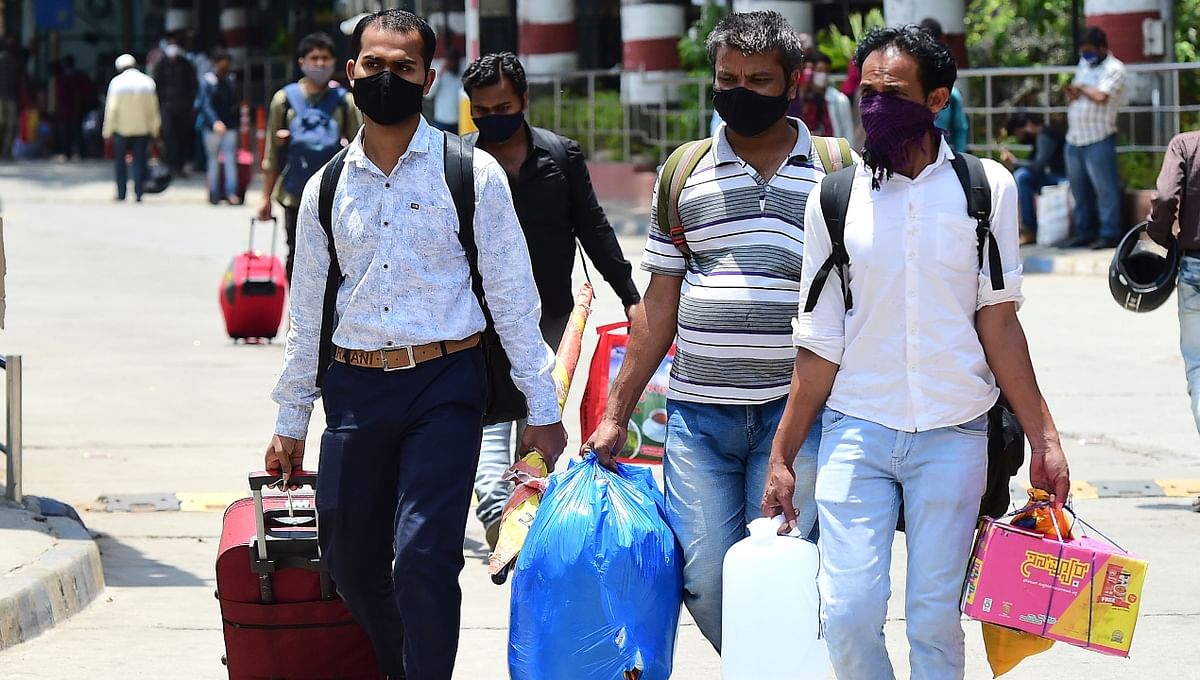 Migrant workers, desperate to return to their hometowns, arrive at a railway station in Bengaluru.