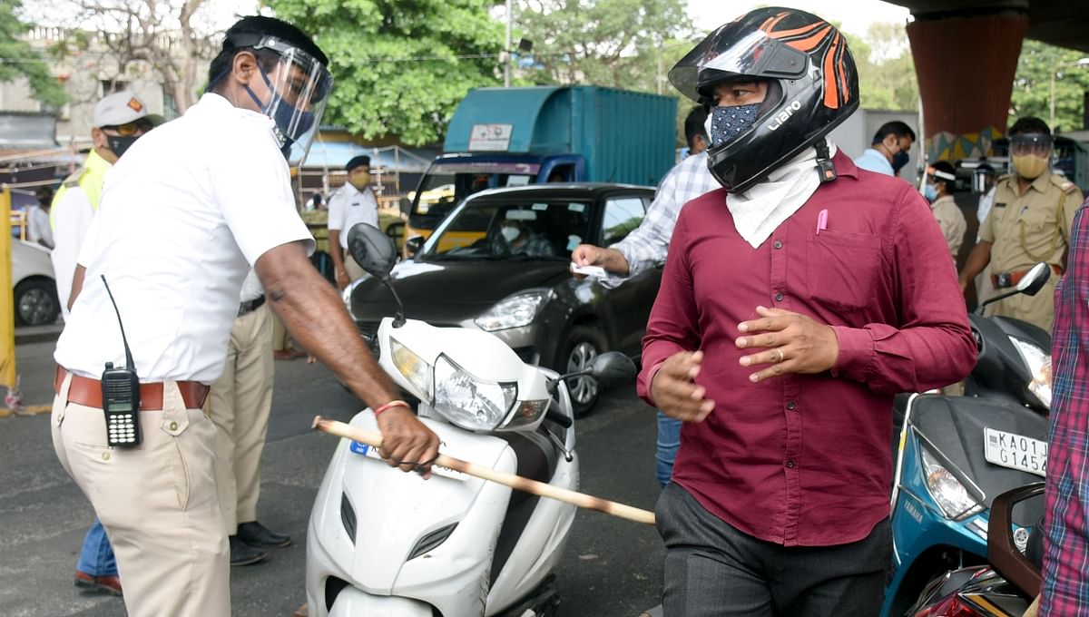 A baton-weilding cop is seen punishing a biker.