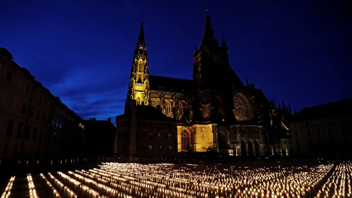 General view of candles lit to commemorate all Czech victims of the Covid-19 pandemic at Prague Castle in Prague. Credit: Reuters Photo
