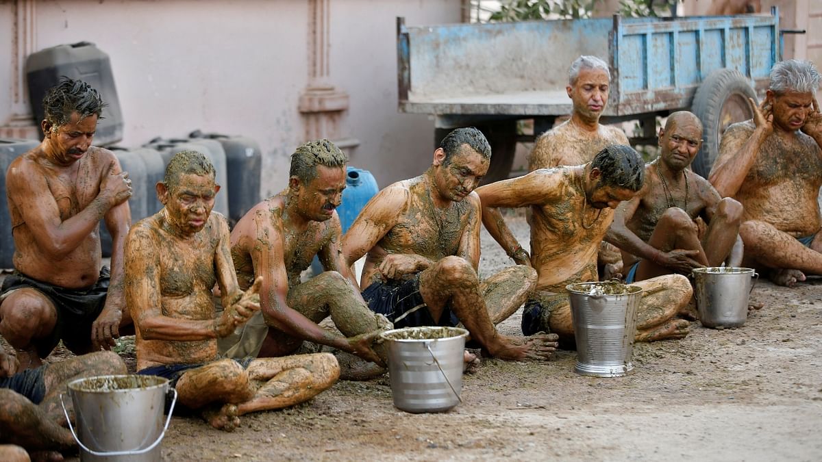 People apply cow dung on their bodies during