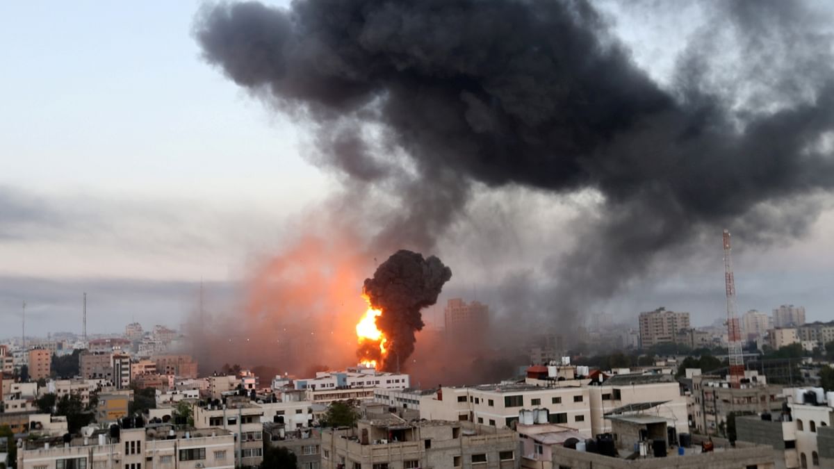 Smoke and flames rise during Israeli air strikes amid a flare-up of Israeli-Palestinian violence, in Gaza. Credit: Reuters