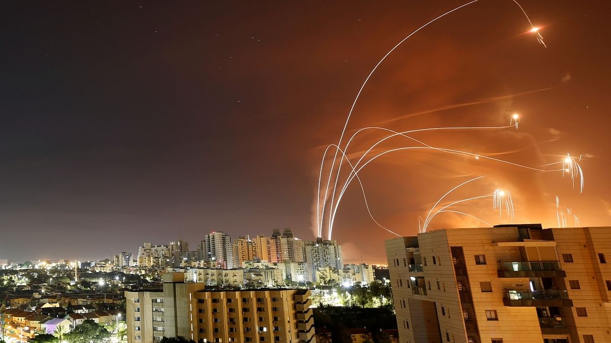 Streaks of light are seen as Israel's Iron Dome anti-missile system intercept rockets launched from the Gaza Strip towards Israel, as seen from Ashkelon, Israel. Credit: Reuters