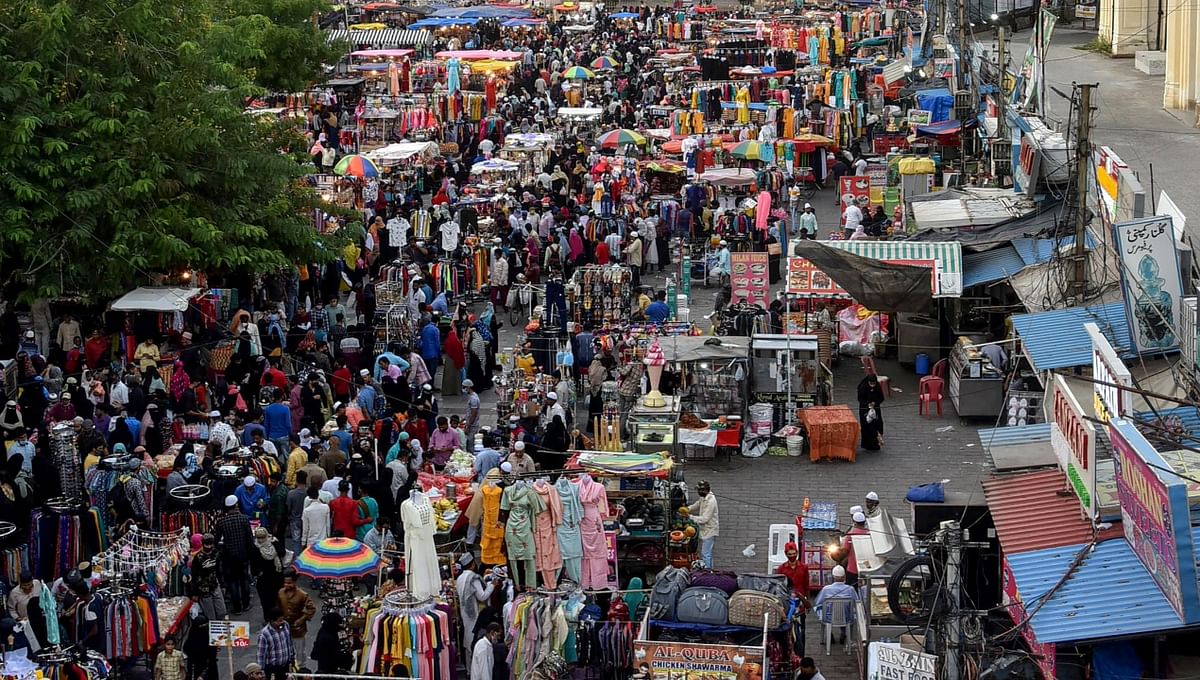 People visit a crowded market near the historic Charminar, ahead of Eid-ul-Fitr Festival, in Hyderabad. Credit: PTI Photo