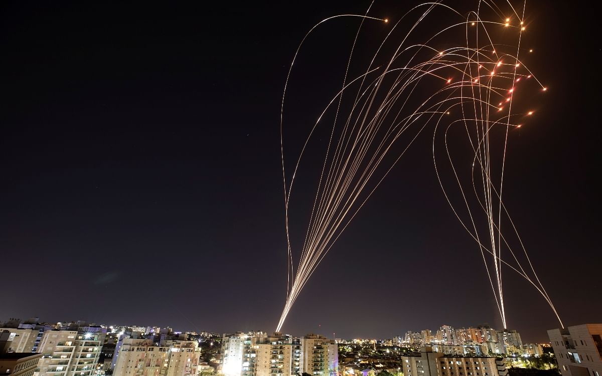 Streaks of light are seen as Israel's Iron Dome anti-missile system intercepts rockets launched from the Gaza Strip towards Israel. Credit: Reuters