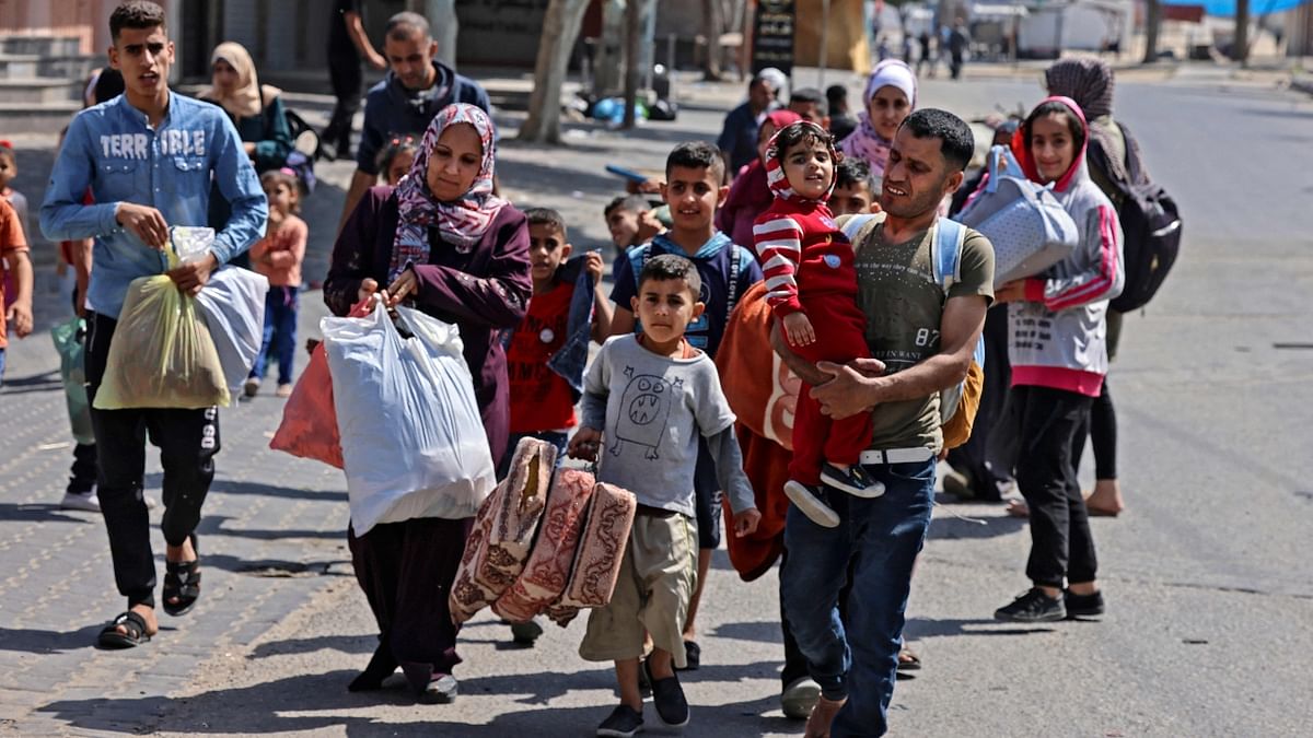 Palestinians flee Gaza as Israeli bombardment continues.