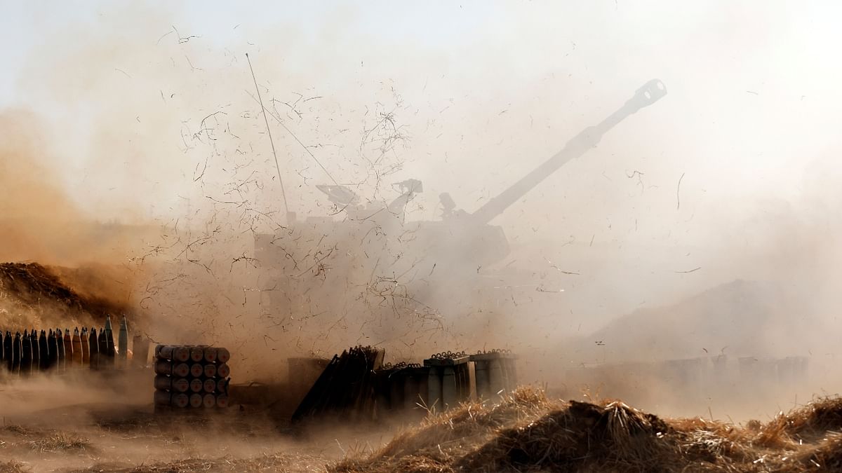 An Israeli mobile artillery unit fires near the border between Israel and the Gaza Strip.