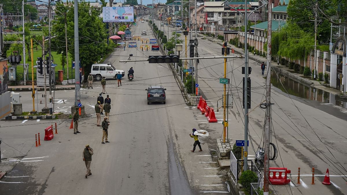 Security personnel stand guard on Eid-ul-Fitr, during Covid-induced lockdown as coronavirus cases surge in Srinagar.
