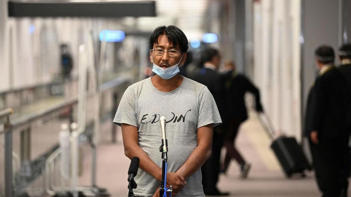 Japanese journalist Yuki Kitazumi, who was arrested by security forces while covering the aftermath of the Myanmar coup, speaks to the media upon his arrival at Narita Airport in Narita, Chiba. Credit: AFP Photo