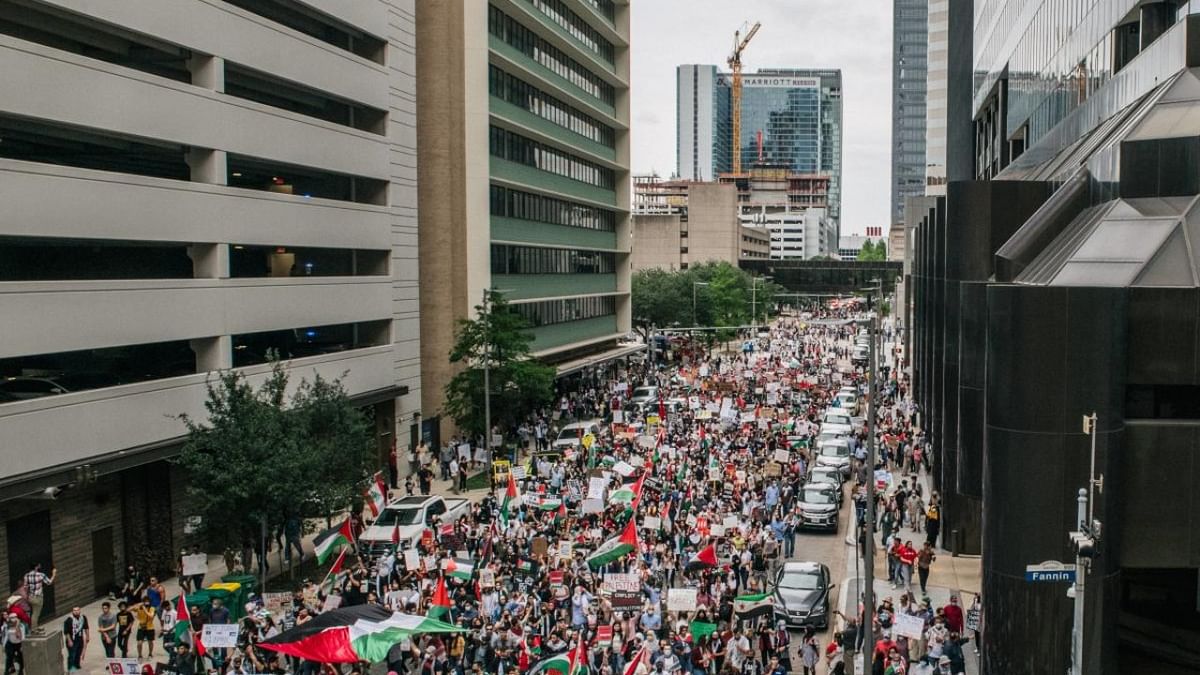 People march to the Houston City Hall on in Houston, Texas. People gathered during a rally to show support for Palestinians facing Israeli airstrikes in the Gaza Strip. Credit: AFP Photo