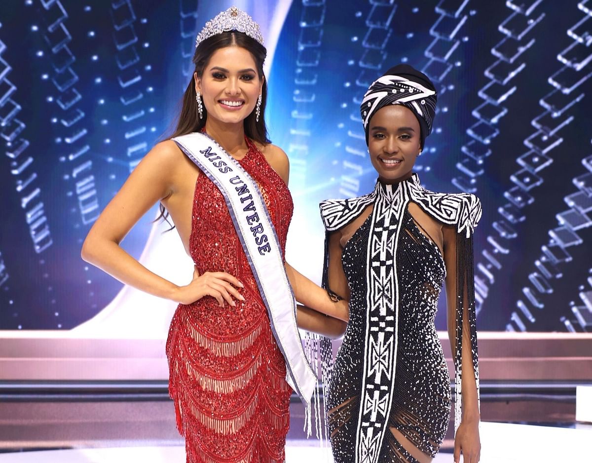 Miss Universe 2020 Andrea Mesa and Miss Universe 2019 Zozibini Tunzi pose together for a photo.