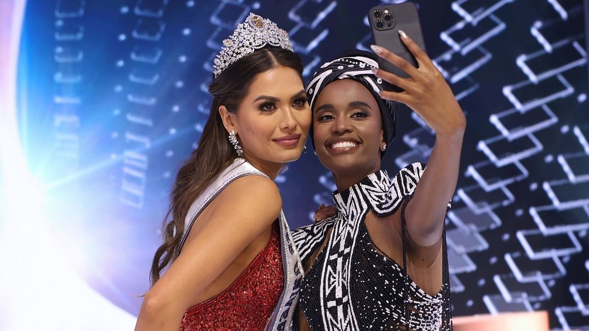 Miss Universe 2019 Zozibini Tunzi takes a selfie with Miss Universe 2020 Andrea Mesa.