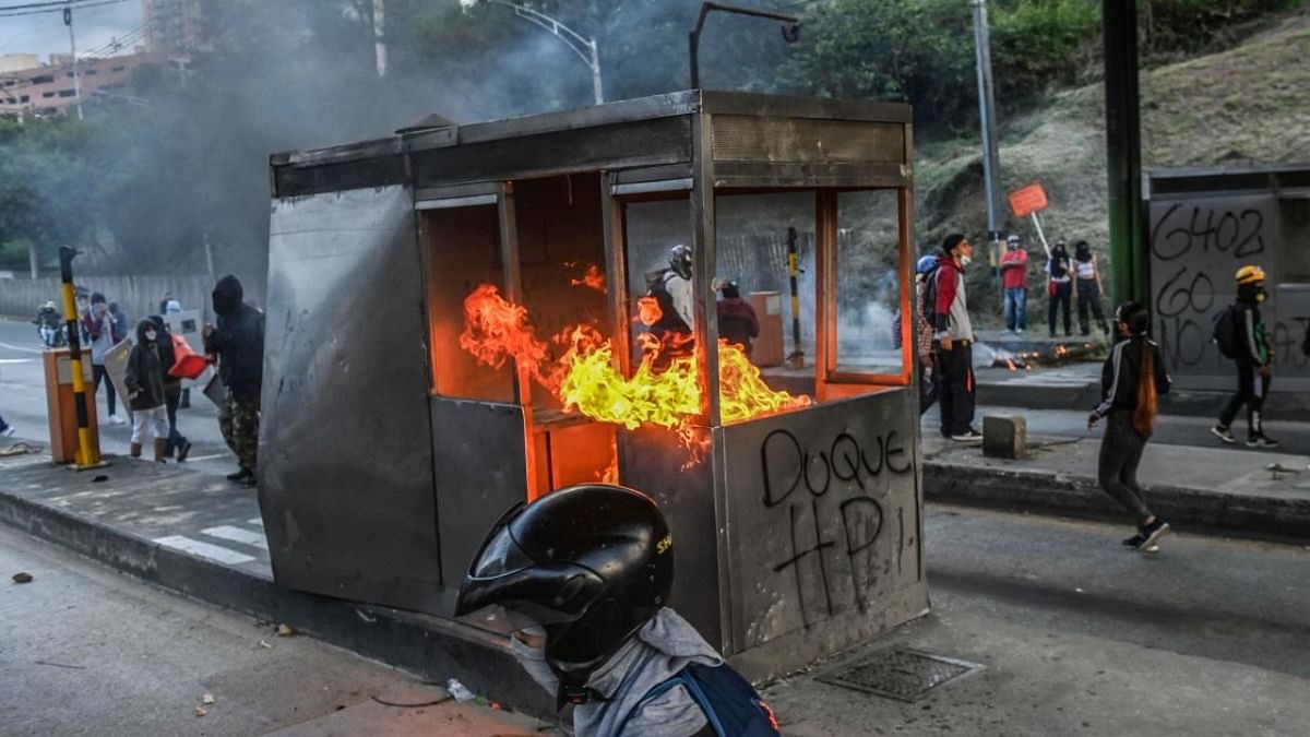 Demonstrators set fire to a toll booth during a new anti-government protest in Medellin, Colombia. Credit: AFP Photo