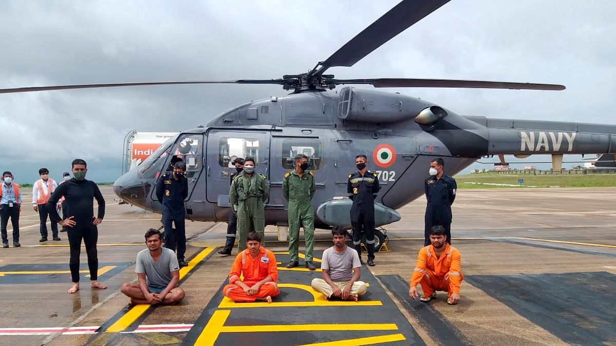 Four crew of Tug Coromandal Supporter IX, grounded off Mulki rocks in Karnataka, after they were airlifted in a Navy helicopter. All 9 crew have been saved by ICG and Indian Navy. Credit: PTI