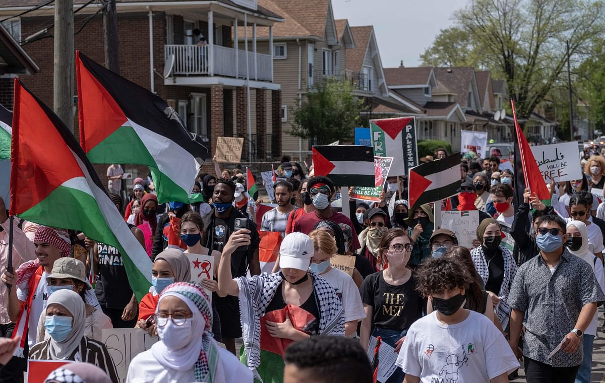 Protesters march through neighborhoods near a Ford Motor Company plant in Dearborn, Michigan where US President Joe Biden is touring, to protest the Biden's continued support for Benjamin Netanyahu's administration. Credit: AFP Photo