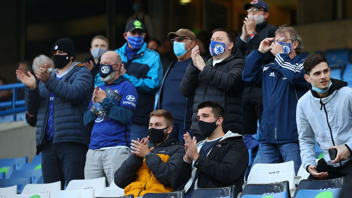 Chelsea fans are seen in the stand before the match as a limited number of fans are permitted at outdoor sports venues in the United Kingdom as Covid-19 restrictions were eased in the country. Credit: Reuters Photo