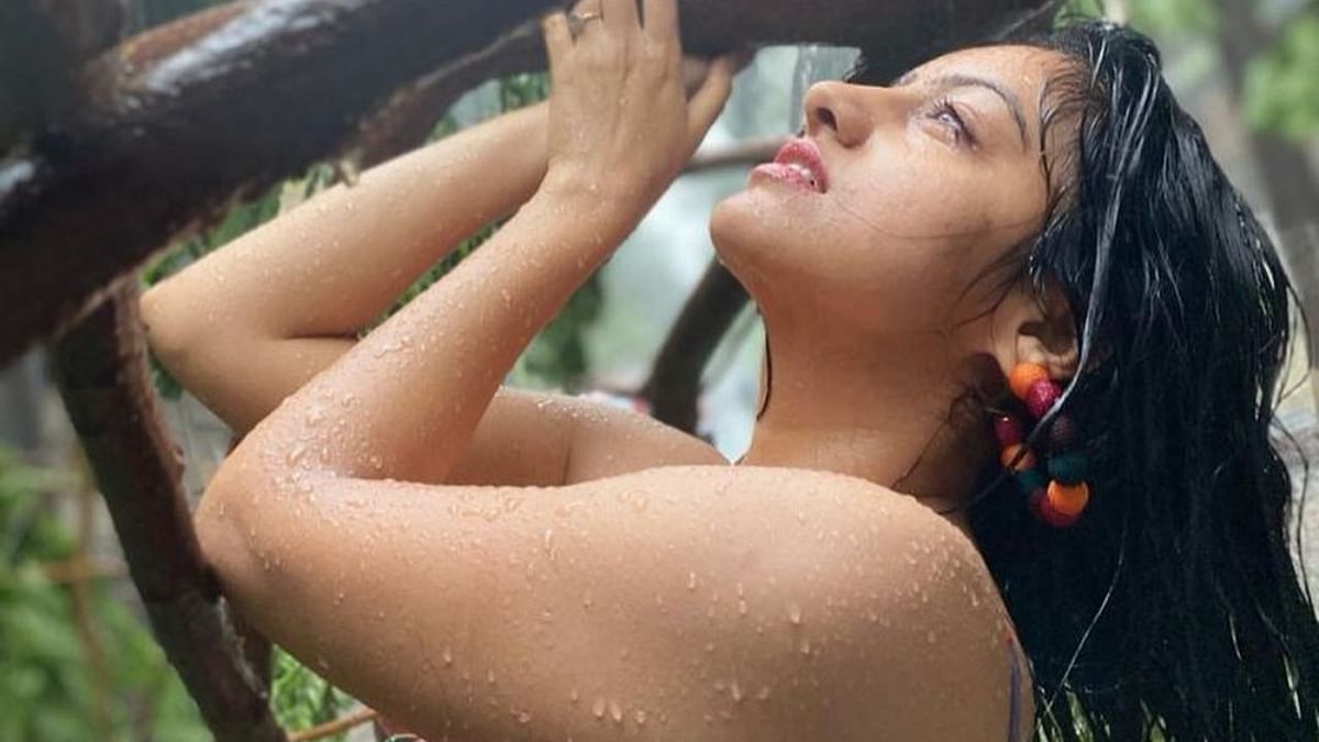 Actress Deepika Singh Goyal is seen posing with the uprooted trees amid cyclone Tauktae.