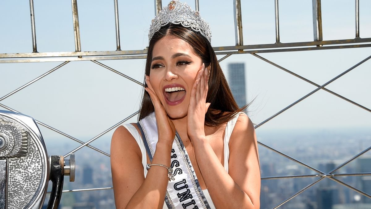 Miss Universe Andrea Meza reacts during a photocall.