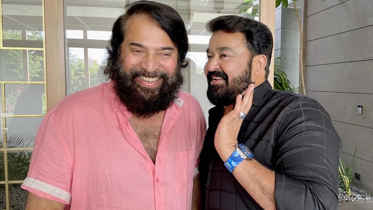 Check out this candid picture of Mohanlal sharing sweet nothings with legendary actor Mammootty.