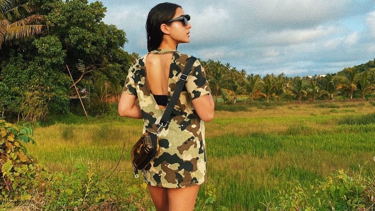 Sara went for a chic-summer look, pairing a backless camouflage dress with super cool sunnies, making it your next road trip staple.