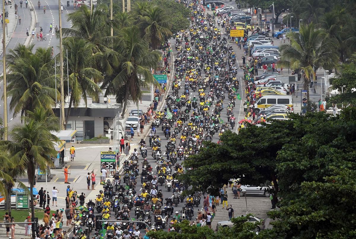 Supporters of the Brazilian President Jair Bolsonaro take part in a motorcade rally along Copacabana beach in Rio de Janeiro, Brazil. Credit: AFP Photo