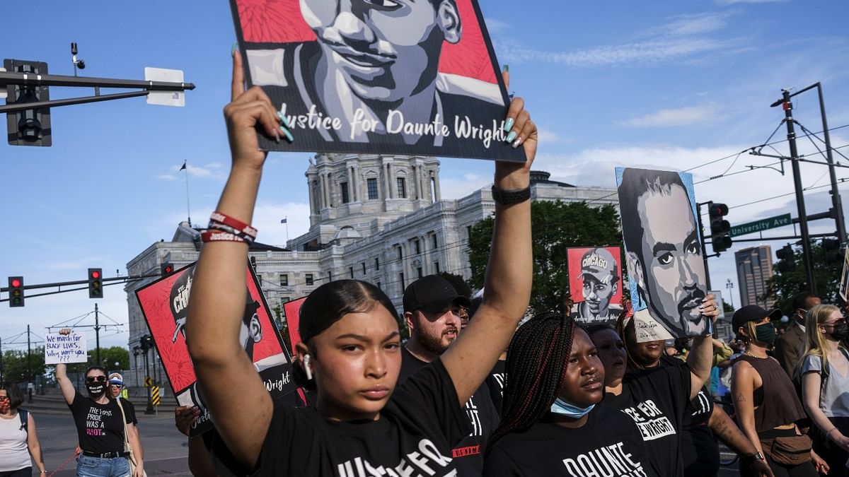 The “Rise and Remember George Floyd” celebration, including a candlelight vigil at 8 p.m., caps several days of marches, rallies and panel discussions about his death and where America is in confronting racial discrimination. Credit: AFP Photo