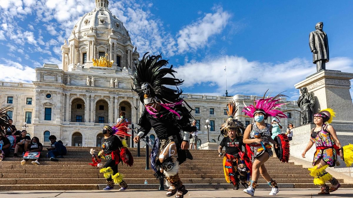Members of the Kalpulli Ketzal Coatlicue perform a dance during an event in remembrance of George Floyd and to call for justice for those who lost loved ones to the police violence outside the Minnesota State Capitol in Saint Paul, Minnesota. Credit: AFP Photo