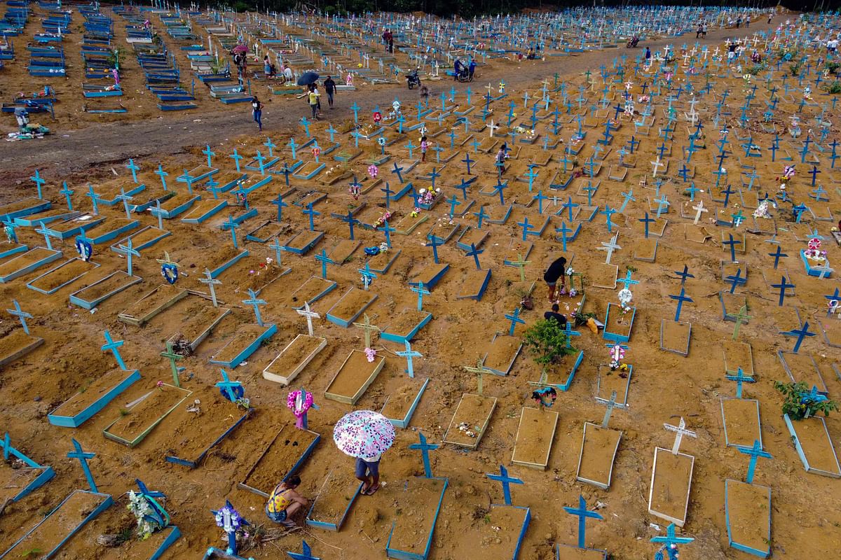 In this file aerial picture taken on May 9, 2021 people visit the Nossa Senhora Aparecida cemetery on Mothers Day, in Manaus, Amazonas State, Brazil. Credit: AFP Photo