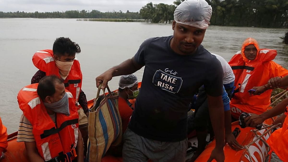 People are evacuated from a flooded area to safer place by the members of the National Disaster Response Force (NDRF) as Cyclone Yaas makes landfall at Ramnagar in Purba Medinipur district in the eastern state of West Bengal. Credit: Reuters Photo
