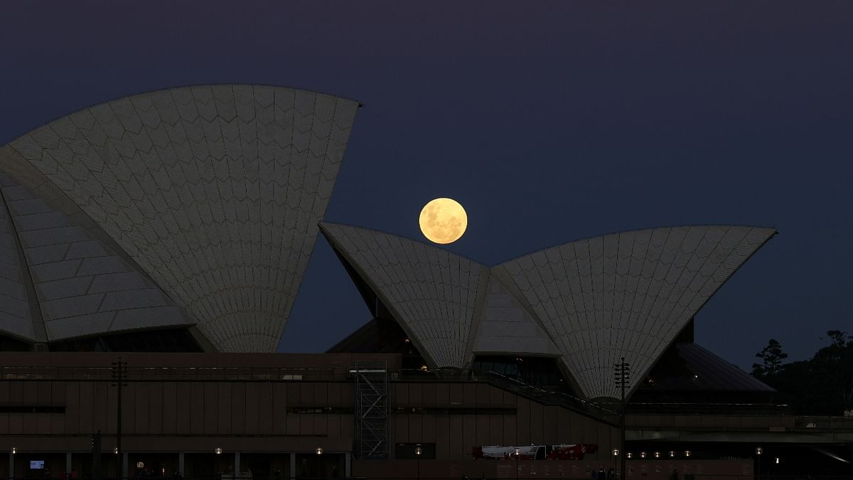 A Super Flower Moon rises behind the Sydney Opera House on the night of a lunar eclipse, in Sydney, Australia. Credit: Reuters Photo