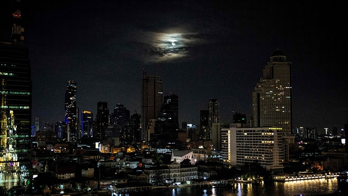 The moon is seen over the Bangkok skyline on May 26, 2021. Credit: AFP Photo
